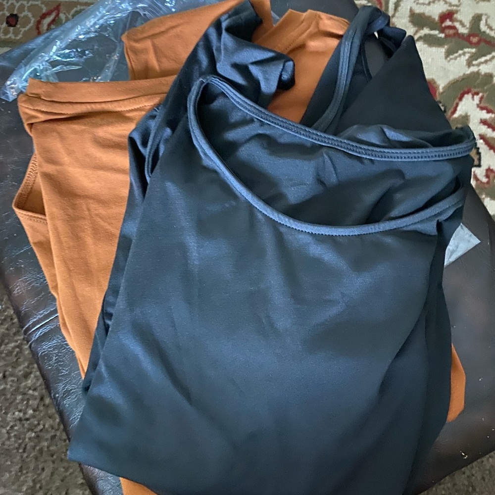 Body suits. 2- 1 rust colored and black XL